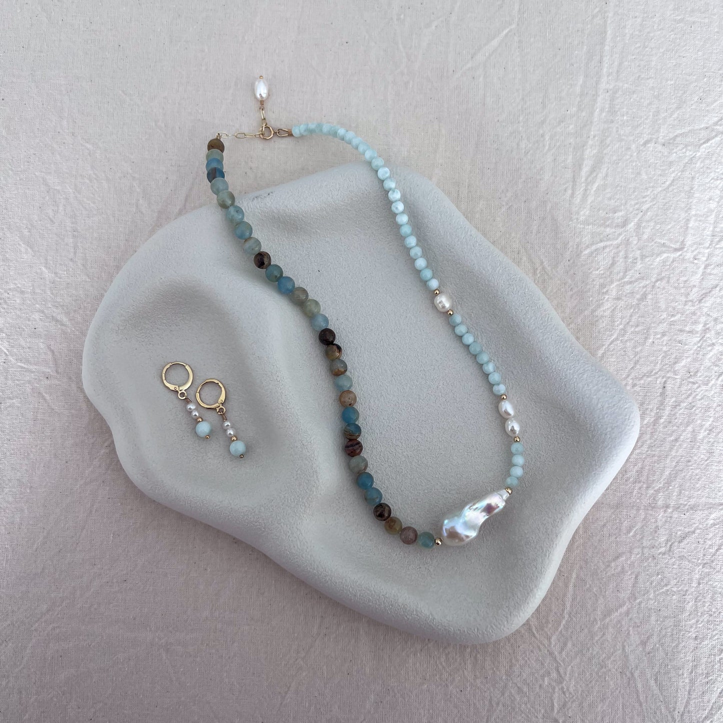 One-of-a-kind blue calcite, green angelite and freshwater baroque pearl necklace with matching gemstone earrings by SunVoyager Jewellery.