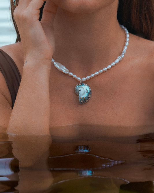Handmade sterling silver nautilus shell necklace with freshwater pearls, Keishi pearl, and silk cord 