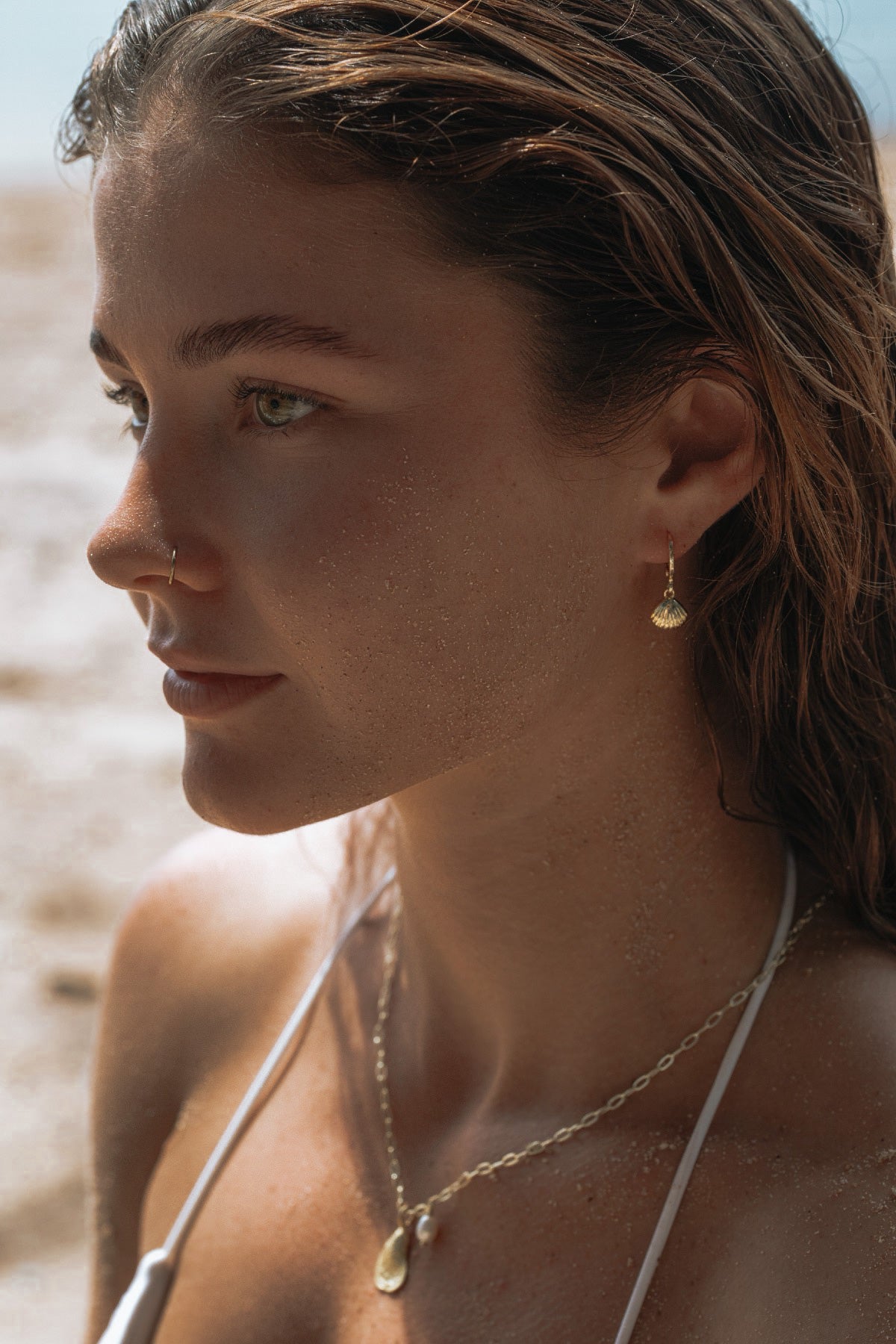 Gold-filled clam shell huggie earrings, handcrafted in Australia, inspired by the ocean
