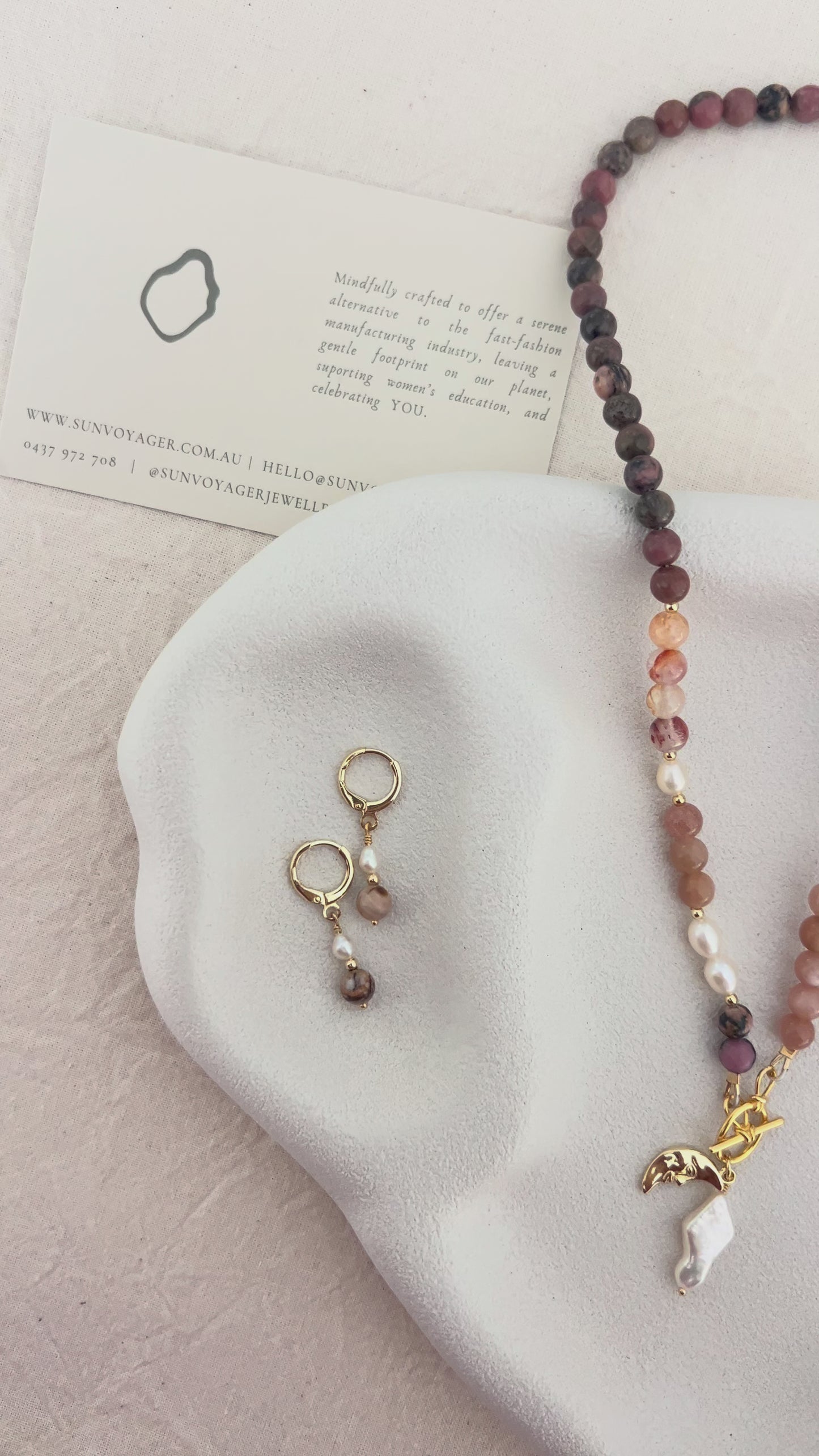 Handmade red quartz, rhodolite and sunstone gemstone necklace with freshwater pearls and an 18k gold-filled front toggle clasp.