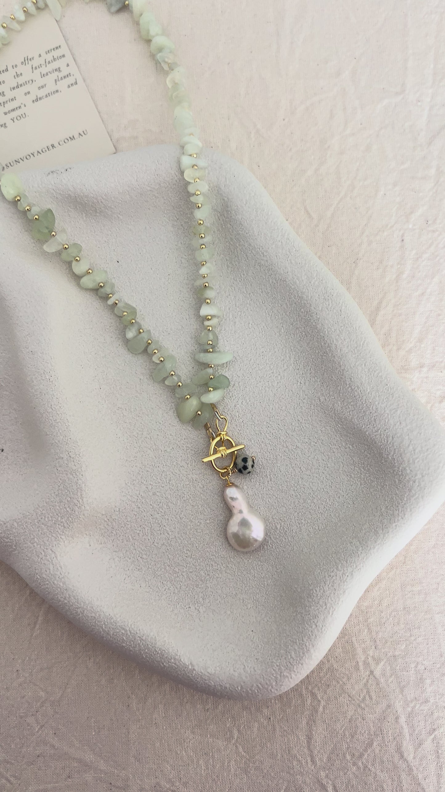 Natural jade stones in soft pale green tones interrupted by gold-filled beads in a handmade SunVoyager necklace.